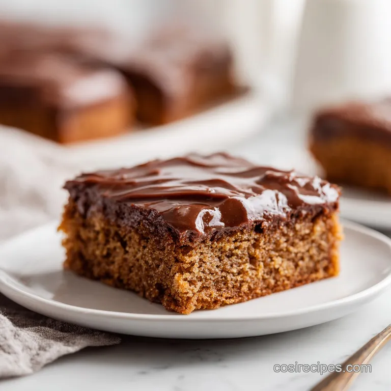 A single, fudgy slice of dark chocolate cake, showcasing its moist crumb and glossy frosting.
